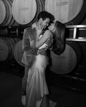 Taylor Lautner Instagram - WELCOME PARTY
Following rehearsal dinner, doors opened to the rest of the underground wine caves where we held a party to welcome all of our guests to Paso Robles for the weekend. Two black wooden bars, grey stoneware plates, charcoal tufted couches and loveseats, and gorgeous concrete and wooden starburst cocktail tables were additional details which enhanced the existing environment, and played into the underground winery aesthetic. We are true foodies at heart so we wanted to give guests an assortment of options to indulge in. This included 4 different food stations to satisfy every palate. A Mezze station, oyster and seafood bar, Tapas station and an Americana station. Our personal favorite was the chef carved Jamoń Iberico and chef manned raclette cheese melter. Complimenting the delicious food of course was Epoch’s killer wines. It truly was the most unique environment and best way to welcome all of our family and friends to a place that holds such a special spot in our hearts. 
Let the festivities begin! 

Planning and Event Design @samkoma.world 
Venue @epochwines 
Photography @nicoleivanovphoto 
Lighting @tn_event_designs