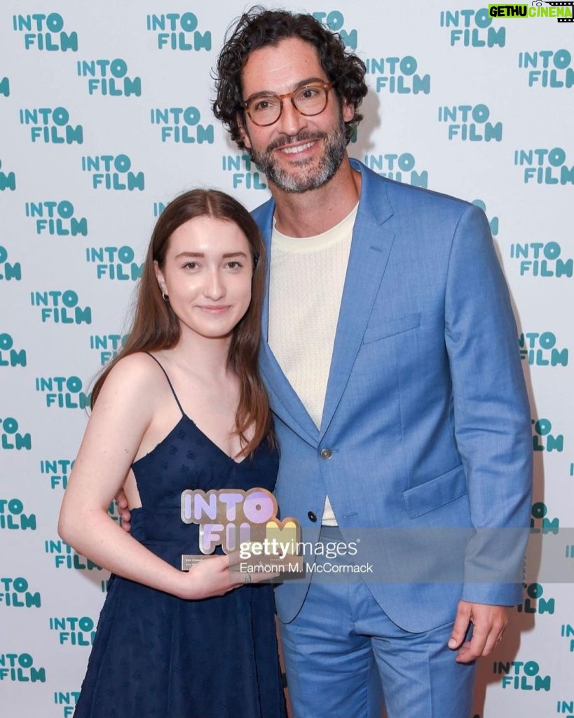 Tom Ellis Instagram - What a privilege to be invited to present at the #intofilmawards this week. I was blown away by the talent on show and was very happy that Zoe won the award for best animation 12 and over for her incredibly moving short ‘Mia’ The future of British film making is looking very bright indeed. ❤️ Thanks to @boss and @gracegilfeather for the dapper look and @samcmakeup for taming the curls #intofilm