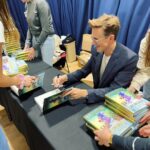 Tom Fletcher Instagram - That’s a lot of books! Thanks to @ourbookshoptring and @rosietellstales for hosting an awesome event for me at @tringschool today, and of course thanks to all the kids for listening to me chat about Christmas in October! They told me @jeffkinney signed this many books in under 30 minutes which sounded like a challenge to me. 😜 Did I break his record?! #thechristmasaurus #christmasaurus #christmas #dinosaurs #books #childrensbooks