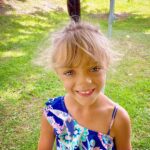 Tyler Baltierra Instagram - I found this feather while we were camping & Novalee just had to have it in her hair lol it made her so happy & she felt so pretty! I can’t believe she is starting Kindergarten this year. Like how did this happen so fast!? One day I’m rocking her to sleep listening to her little baby snores on my chest & the next day she’s off on a bus like a big kid. But no matter how old she gets, I will always cherish the moments spent putting a smile on that beautiful face! 😍❤️😭 #NovaleeReign