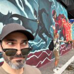 Tyler Hoechlin Instagram - Stumbled across some familiar faces down an alley in São Paulo. Also… stole a page out of Clark Kent’s book. Thanks for having me, Brazil! ‘Twas a visit long overdue. Beco do Batman