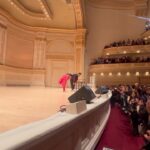 Vikas Khanna Instagram - What a history creating moment today. VIR DAS performed at the iconic Carnegie Hall in NY to a sold out audience. So much energy & brilliance on stage. This is not the first time Vir created history. On Nov 20th, he had won the International Emmy. More power to you brother for making India proud. XX 1. Vir enters the stage at the iconic @carnegiehall 2.3.4. Mesmerized audience 5. Standing applause for @virdas & @zarnagarg for 5 minutes. ❤️🥰 6.7. Backstage 8. Vir announced as a WINNER at Emmy 9. The king arrives & I shot it through Ekta Kapoor’s Emmy 10. Backstage