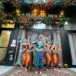Vikas Khanna Instagram - Today we had an amazing prayer dance to honor the land on which Bungalow is built. The dance begins with Odissi’s trikhandi (three-fold) pranam seeking the blessings of Mother earth (the ancient ritual of bhoomi pranam), the gods, gurus and seniors. Performances by Surati for Performing Arts choreographed and led by Founder and Artistic Director Rimli Roy. Indian dance movements based on Odissi classical dance from the State of Orissa characterized by its subtle torso movements, asymmetrical stances like tribhangi made of three body bends and fluid wristwork. Surati company dancers included Reba Browne, Jeevika Bhat, Tanvi Chandak and Annie Renita. 8 Days To Go…