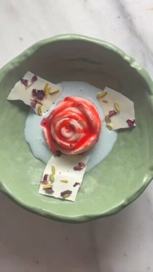 Vikas Khanna Instagram - Namaste New York. 

Our first dish is inspired by ROJA, in Tamil it means Rose or Sensitive. 
Our humble tribute to the first film - ROJA of maestro AR Rahman. @arrahman 

Candied Rose Petal Kulfi, Butterfly Pea Rabri, Kashmiri Rose & Pistachio Bark, Rose-Kewra Syrup. 

Timeless music to flavors of our heritage.

32 Days To Open @bungalowny