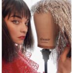 Annie Murphy Instagram – Because my name is Annie and the mannequin head also has Annie on it which is my name, so I’m holding it next to my real head. 📸: @ana_sorys