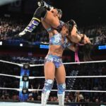 Bianca Crawford Instagram - Abs contoured with nothing but HARD WORK. … and genetics. We stay putting in werk over here! #ESTofWWE #wrESTleMania #Smackdown Gear: Made by ME