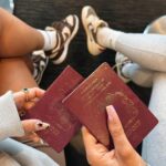 Chloe Burrows Instagram - Besties who travel together and wear matching @whitefoxboutique hoodies 😉✨ let’s gooooo 🇺🇸 Oh and matching dirty old passports 😅 ad Use code MILLIEGRACE or CHLOEB for 30% discount off the website 🫶🏼 Heathrow Airport