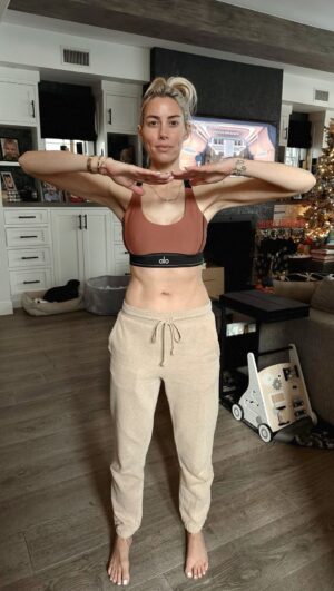 Heather Rae El Moussa Instagram - Transformation is an understatement 🤍 My postpartum journey was… not at all how I expected. If I’m being honest, I thought I would be the person who bounced back really quick — when I was pregnant I said “I’ll be working out 5 days a week & hot yoga non stop, I’ll have my body back in 9 weeks” LOL well then reality set in & my priorities are just different now. 

I’ve always been active and ate clean, nutritious foods throughout my pregnancy— but after 4 1/2 ish months of being postpartum, I got diagnosed with an autoimmune thyroid disorder which made it a lot harder for my body to go back to “normal”.

My trainer (Paulina) came to me at the perfect time. I was 4 months postpartum. Working out here & there and mainly doing cardio. She’s a mama herself so she knows the female body very well and is super knowledgeable about postpartum. We started my journey slow but she also pushes me & holds me accountable. I’m so busy, life is chaotic most days so having someone who comes to my home is a game changer for me. Plus to be honest I’d rather be home in the AM with my baby than leave him to go workout. 

I could go on and on but I wanted you guys to see my journey- I’m so proud of myself and of my body. I have truly learned to love my body more than ever, prioritize my health & happiness, and feel confident in the skin I’m in. 

So much can happen and change within a year so if you’re seeing this, keep going, keep pushing, believe in yourself, but also give yourself time and give yourself grace 🤍 Reflecting on my 2023 postpartum transformation and excited for a new fresh year & I have decided to commit to one day of hot yoga again 🫶🏻