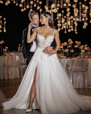 Lindsey Morgan Instagram - 🤍

#Repost @sophisticatedweddings
・・・
We admit it: we just can't wait to start sharing the images (and video) from our photo shoot at The Glasshouse with affianced (and breathtakingly gorgeous) couple Lindsey Morgan and Shaun Sipos. They're too good to wait until mid-September for the release of our Fall/Winter Edition.

With that in mind, today's blog post on the LIFESTYLE page of SophisticatedWeddings.com has a bunch of second choice photos and behind-the-scenes video to hold us all until the new issue comes out!

pictured:
venue: The @Glasshouses.NYC
bride: @LinzzMorgan
groom: @Shaun_Sipos
photo: Marcin Pawlowski for @CharmingImages
cinematographer: @ShuttersoundPics
designs: @PremierEventsByReema
furniture rentals: @Christina_AFRnyc
dress: @MillaNova for @BridalReflectionsNY
custom tuxedo: @Sartoro.co
jewelry: @WilliamBarthman
headpieces: @BridalStylesBoutique
makeup & hair: @BridalGal
#
#
#SophisticatedWeddings 
#LindseyMorgan #ShaunSipos 
#Wedding #WeddingPlanning #Engaged #GettingMarried #BrideAndGroom 
#HereComesTheBride
#YouMayNowKissTheBride