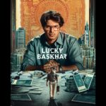Meenakshi Chaudhary Instagram - Here’s the first look of our ambitious #LuckyBaskhar!💰🏦 Story unfolds in Telugu, Malayalam, Tamil & Hindi at the theatres near you, soon! 🔥 @dqsalmaan @venky_atluri @gvprakash @nimishravi @NavinNooli @benglann @nagavamsi19 #SaiSoujanya @sitharaentertainments @fortune4cinemas #SrikaraStudios