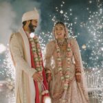 Neeti Mohan Instagram - Overjoyed and Beyond Grateful for such an auspicious occasion in our family. Papa had to miss our wedding due to health reasons but this time, in his presence the wedding felt complete. Thank you God for this 🙏🏼🥹 We feel blessed, as with folded hands we welcome Thakur Family in our lives. Welcome home @whokunalthakur 🌹🫶🏻 Ab tum bhi Mohana gaye ho! Golu! our choti bacchi @muktimohan wishing you a lifetime of happiness, prosperity and love ❤️ Sabka khayaal rakhna aur apna sabse zyaada. Mud ke na dekho Dilbaro 😥 #KunalKoMiliMukti Thank you for capturing these precious moments @themadeinheaven 🫶🏻