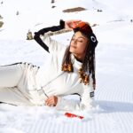 Pearl Thusi Instagram - Why play games when you’re already on the throne? Winter comes only to those who fear it. The brave chase it.🌬️❄️🤍 Enveloped in the enchantment of @tomorrowlandwinter with a magical combo - A coke and a smile. We chilling on ice baby! #realmagic #tomorrowlandwinter #cokestudio Tomorrowland Winter