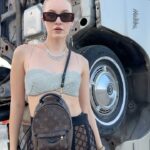 Polina Pushkareva Instagram - Conclusions on Coachella 2023: the guide on how to survive Coachella is a challenge. You're trying to chill and enjoy the atmosphere, music, dating, but it's very hard to be in the desert. Wanna share my thoughts after the fest and what I will do next year. 1.Wear only gathered hairstyles and fix them well with hairspray. The wind is fuckingly strong, so the loose hair quickly turns into a nest. 2. Always carry a lipstick with you to quickly fix your makeup. If you can do without any lipstick, it's even better. Plus, dust sticks on the lipstick which is quite unpleasant. 3. Wear cool and not super comfortable outfits for photo shoots in the desert. And it’s better to go to the festival in comfortable clothes, in which you can spend the whole night. 4. The face mask is a must-have. Be sure to take a backpack with you (not just a beautiful handbag) and put into it antihistamines, medicines for stomach and any other pills that you may need. Anything can happen in the desert, and the medical center is not always nearby. 5. Live alone and meet friends at the festival. That's perfect. You can wake up and fall asleep whenever you want, do whatever you want and not adapt to other people's plans. 6. Come to the festival by 7 p.m. Unless, of course, someone you love performs during the day. After 5 hours there you get so tired that you don't enjoy it anymore. And the top artists start performing in the evening. 7. Take a tripod. I took all the photos in this trip myself. I just put the camera and posed as much as I wanted. If content is your priority, take a tripod, set aside one hour and calmly shoot yourself in different locations. Btw, which outfit do you like most of all? Coachella, California
