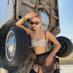 Polina Pushkareva Instagram - Conclusions on Coachella 2023: the guide on how to survive Coachella is a challenge. You're trying to chill and enjoy the atmosphere, music, dating, but it's very hard to be in the desert. Wanna share my thoughts after the fest and what I will do next year. 1.Wear only gathered hairstyles and fix them well with hairspray. The wind is fuckingly strong, so the loose hair quickly turns into a nest. 2. Always carry a lipstick with you to quickly fix your makeup. If you can do without any lipstick, it's even better. Plus, dust sticks on the lipstick which is quite unpleasant. 3. Wear cool and not super comfortable outfits for photo shoots in the desert. And it’s better to go to the festival in comfortable clothes, in which you can spend the whole night. 4. The face mask is a must-have. Be sure to take a backpack with you (not just a beautiful handbag) and put into it antihistamines, medicines for stomach and any other pills that you may need. Anything can happen in the desert, and the medical center is not always nearby. 5. Live alone and meet friends at the festival. That's perfect. You can wake up and fall asleep whenever you want, do whatever you want and not adapt to other people's plans. 6. Come to the festival by 7 p.m. Unless, of course, someone you love performs during the day. After 5 hours there you get so tired that you don't enjoy it anymore. And the top artists start performing in the evening. 7. Take a tripod. I took all the photos in this trip myself. I just put the camera and posed as much as I wanted. If content is your priority, take a tripod, set aside one hour and calmly shoot yourself in different locations. Btw, which outfit do you like most of all? Coachella, California