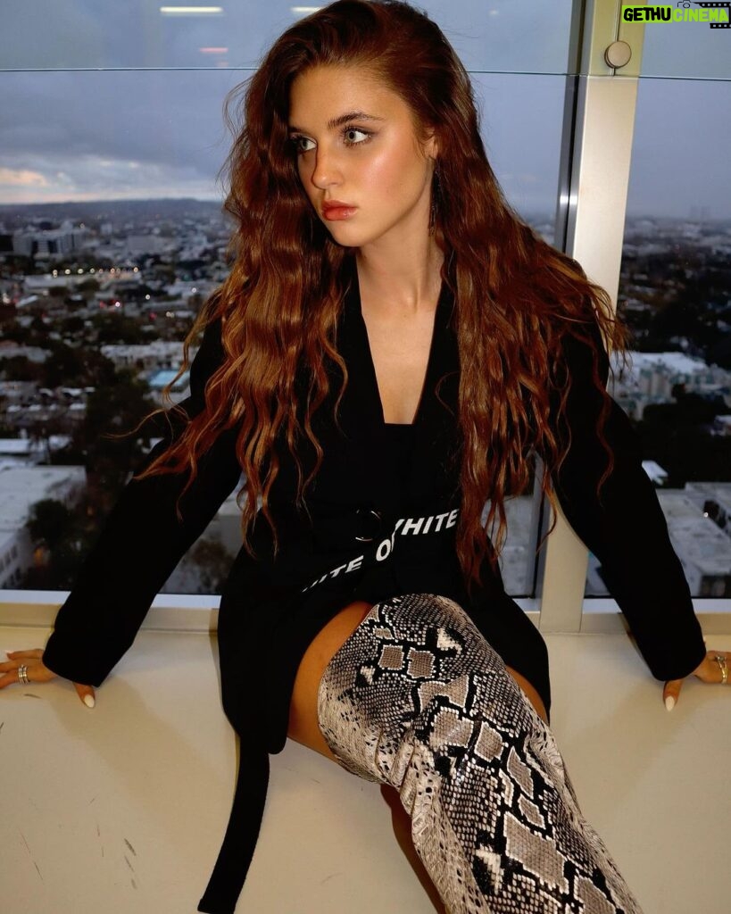 Savannah Clarke Instagram - C A R P D I E M _________________________________ Seize the day : To put aside all differences , all fears , all worries , and just go for it. _______________________________________ #CarpDiem #SiezeTheDay #QuotesToLiveBy #OversizedJackets #SnakePrint #ThighHighBoots #SignatureLook #DayAtWork #PerformanceDay #CrimpedHair #Belt #BootsLover #EveningsWithAView #JustGoForIt _____________________________________ West Hollywood CA