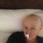 Shannen Doherty Instagram - For breast cancer awareness month, I’d like to share more of my own personal journey from my first diagnosis to my second. Is it all pretty? NO but it’s truthful and my hope in sharing is that we all become more educated, more familiar with what cancer looks like. I hope I encourage people to get mammograms, to get regular checkups, to cut thru the fear and face whatever might be in front of you. In 2015 I got diagnosed with breast cancer. I had a mastectomy and did chemo and radiation. I had many nose bleeds from the chemo. Not sure if any of you experienced this. I also was beyond tired. I cheered myself up by putting on funny pajamas that my friend Kristy gave me. Did they actually cheer me up? Yes!! Lol. I looked ridiculous and in that ridiculousness, I was able to laugh at myself. Finding humor helped get me thru what seemed impossible. I hope we all find humor in the impossible. #breastcancerawareness