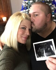 Tori Spelling Instagram - I can’t believe it’s been 6 months… and I’m a day late. But, Scouty would understand and expect nothing less. I’m always late. In this picture, we are revealing that my baby, my 5th and final baby is a BOY. Scouty was such a creative. We bonded over so many things during our 21 year friendship but love of crafting was one of them. He was such an amazing DIY’er. From party planning to home decor to the most amazing dessert tables. He truly could do it all. So, for the gender reveal of our fifth and final baby I asked Scouty if he would do us the honors of unveiling the reveal. It was Christmas time 2016 and while our family went out Guncle Scouty @scoutmasterson and Guncle Billy @thebillhorn and cousins Simone and Boz decorated the tree. When we walked in we walked into our living room to see the most beautiful baby blue decorated Christmas tree 🌲. We were blown away. All so excited to learn we had a baby boy { Beau} baking in my belly. Well, all of us except a 4 year old Hattie who started crying because she wanted the baby to be a girl 😂. We take small moments like this and the feel of a friend or family member’s hug for granted. Then, when you realize you’ll never experience it again you long for it. Wish you could get that time back and not take it for granted. You always think you’ll have time with the ones you love but the reality is life is so precious and you never know what will happen. I know Scouty is so proud of everything Billy is doing for the family. So proud of the father he is. And, so proud of how well his kids are adjusting to what is an impossible situation. The Masterson-Horns are such a brave, strong, kind, and loving family. Missing you Scouty. xoxo