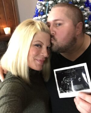 Tori Spelling Instagram - I can’t believe it’s been 6 months… and I’m a day late. But, Scouty would understand and expect nothing less. I’m always late. In this picture, we are revealing that my baby, my 5th and final baby is a BOY. Scouty was such a creative. We bonded  over so many things during our 21 year friendship but love of crafting was one of them. He was such an amazing DIY’er. From party planning to home decor to the most amazing dessert tables. He truly could do it all. So, for the gender reveal of our fifth and final baby I asked Scouty if he would do us the honors of unveiling the reveal. It was Christmas time 2016 and while our family went out Guncle Scouty @scoutmasterson  and Guncle Billy @thebillhorn and cousins Simone and Boz decorated the tree. When we walked in we walked into our living room to see the most beautiful baby blue decorated Christmas tree 🌲. We were blown away. All so excited to learn we had a baby boy { Beau} baking in my belly. Well, all of us except a 4 year old Hattie who started crying because she wanted the baby to be a girl 😂. We take small moments like this and the feel of a friend or family member’s hug for granted. Then, when you realize you’ll never experience it again you long for it. Wish you could get that time back and not take it for granted. You always think you’ll have time with the ones you love but the reality is life is so precious and you never know what will happen. I know Scouty is so proud of everything Billy is doing for the family. So proud of the father he is. And, so proud of how well his kids are adjusting to what is an impossible situation. The Masterson-Horns are such a brave, strong, kind, and loving family. Missing you Scouty. xoxo