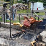 Milla Jovovich Instagram - We’re finally in Newfoundland for the last leg of @everanderson’s new movie #peterpanandwendy! We spent the day walking around the gorgeous town and had lunch at the historic @mallardcottage which was so delicious. They even have their own garden in the backyard and in the last pic you can see the way they roast meat, slow and low on hot coals made of wood from the area. Ever and her co-star @alexandermolonyofficial who plays Peter Pan had a great time finding old bones scattered around and trying to guess what each plant was growing in the garden. It’s a seaside town of charming, old houses painted in brilliant colors, sweet and friendly people and even cool vintage clothing stores. In the evening we sit downstairs at our hotel with the rest of the cast and parents playing Empire for hours! I feel so lucky to be experiencing this with my amazing kiddo! #peterpanandwendy #disney #newfoundland