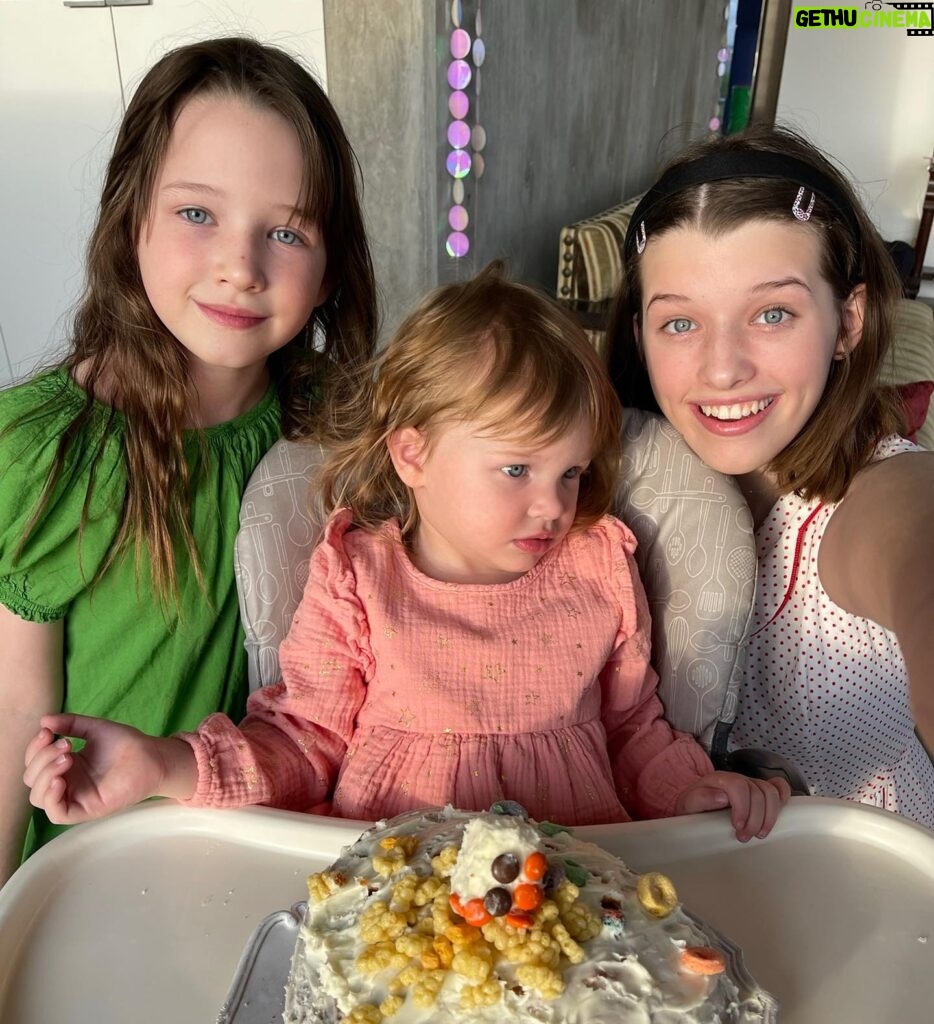 Milla Jovovich Instagram - Happy 2nd Birthday to our sweet Baby Osian!🥳🥳🥳 It’s unreal how quickly time is passing and how we couldn’t imagine our life without her. She truly is a little “Lark”, singing nursery rhymes all day long and squealing with the most amazing sounds of pure joy when she sees us! I’m just in awe of how the older girls have stepped up to the plate in their roles as big sisters. They are so caring and loving, it makes me so proud when I see them together. We love you so much Osi!! ❤️‍🔥❤️‍🔥❤️‍🔥#osianlarkelliot