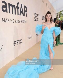 Milla Jovovich Instagram - Thank you @amfar for being a ray of light in this dark world right now. I am so proud to support all the incredible break throughs in medicine that this organization has made possible over the years through their fund raising for people living with HIV/AIDS as well as raising awareness for the prevention of the disease. I was lucky enough to be dressed for the gala by my fellow Ukrainian, the incredible designer @lever_couture! Together, my daughter @everanderson and I completed the Ukrainian flag with our colors on the red carpet! A special thank you to @messikajewelry and my amazing glam team: make up @patidubroff and hair @cyrillaloue!
