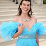 Milla Jovovich Instagram – Thank you @amfar for being a ray of light in this dark world right now. I am so proud to support all the incredible break throughs in medicine that this organization has made possible over the years through their fund raising for people living with HIV/AIDS as well as raising awareness for the prevention of the disease. I was lucky enough to be dressed for the gala by my fellow Ukrainian, the incredible designer @lever_couture! Together, my daughter @everanderson and I completed the Ukrainian flag with our colors on the red carpet! A special thank you to @messikajewelry and my amazing glam team: make up @patidubroff and hair @cyrillaloue!
