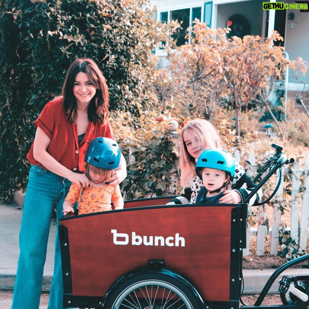 Caterina Scorsone Instagram - Have you been to Holland? One of the rad things about Holland is watching everyone whip around on bikes along the canals. The parents have bicycles with cargo cabs for the kids. Everybody gets to ride. 
October is here, which means it is Down Syndrome Awareness month! Last month @bunchbikes launched the Family Superhero program in an effort to make their awesome bikes more accessible, physically and financially, to more people. 
This bike is roomy, safe, and easy to ride. (And it doesn’t hurt to get a little electric boost when transporting a band of tiny humans around.) My littles and I love our Bunch Bike and we hope you will too! 

Beware! Do not let your toddler bring a random garden gnome with them on the ride. They WILL throw it over the side and the gnome will meet a gruesome demise. RIP Gnome. (It should also be noted that i ALWAYS wear a helmet…except when taking a photograph for an Instagram post.;)

Link in bio for more info about the Bunch Bike Family Superhero Program 🚲 📸 @msage.jpg