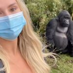 Kinsey Wolanski Instagram - Day 2! Gorilla trekking in Rwanda Africa was actually unreal! We hiked for hours on a volcano in between Rwanda and the Congo to come across silver back gorillas 🦍 
Ps- They made us wear masks

#travel #bucketlist #africa #rwanda #gorillatrekking