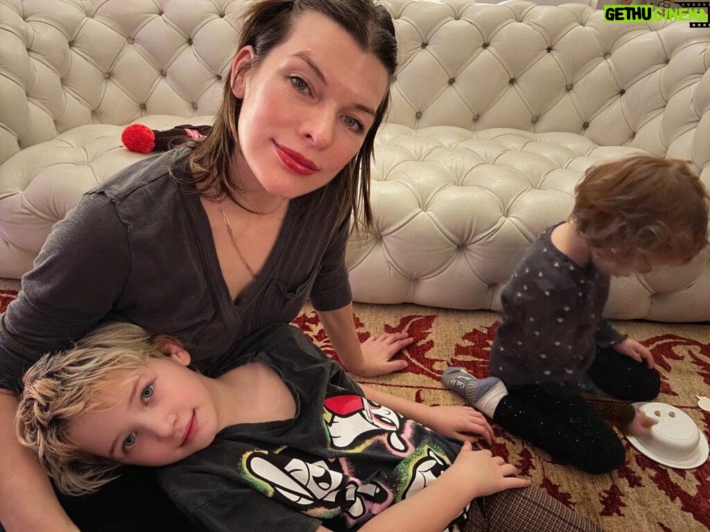Milla Jovovich Instagram - Happy New Year from the Andersons! This post goes back in time of our epic New Year’s Day. It starts with a hard won family photo where almost everyone is in focus.  Before that I made dinner in our hotel using a one burner hot plate (half the food was pretty lukewarm but still delicious). I made my mom’s famous fried potatoes which is always a hit with the kids, but also some gorgeous asparagus and trumpet mushrooms fresh from the farmers market here in Krakow. I even have my super Eastern European wire rack where I keep the veggies☺️. And of course this morning started with an epic New Years trip to the laundromat which though not very glamorous, was extremely necessary😂. I’m sending so much love to everyone and I hope this New Year brings us all health, love and patience for ourselves and others. Ok, it’s time to put the baby down. Have an amazing night everyone!🍾🎆🎊🎉🎈xo m❤️