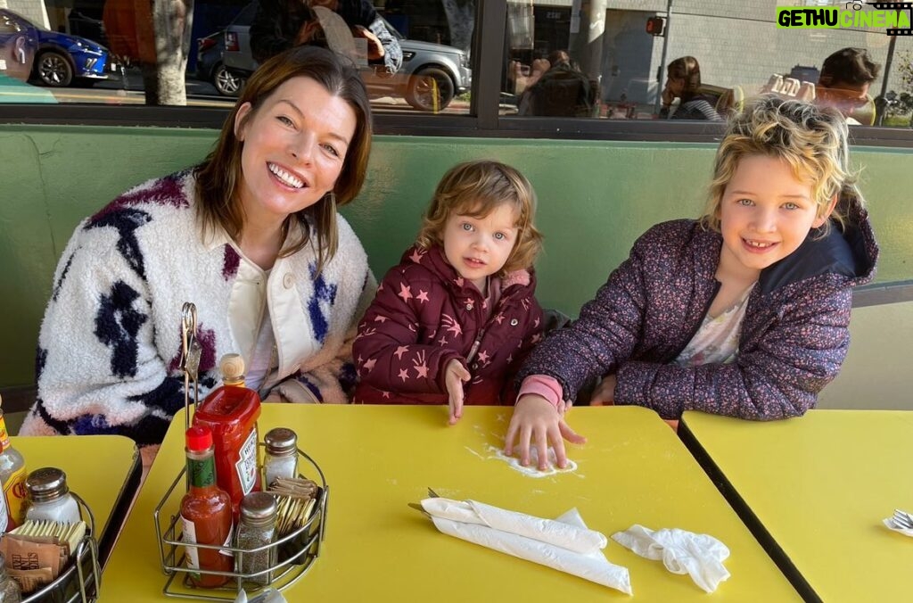 Milla Jovovich Instagram - Happy 3rd Birthday to my amazing littlest one Osian! It’s crazy how she suddenly turned 3 about a month ago. You know the feeling when they’re still toddlers and you can’t really have a conversation with them or reason with them? When they’re just little cave people who are either super happy, super angry, super selfish or super sad with no in between? And then almost overnight they become… little people? And the funny thing is, birthdays don’t really matter, it just happens regardless of when they were born. One day they just “get it”. Well one day about a month ago Osian suddenly began to display this wicked sense of humor. She started being “in on the joke” and with that I realized that my baby had become a full fledged little person who can have conversations and ask a million questions, seeing the world in her own unique, peculiar and truly hilarious way. She is my rainbow baby, my last and final human creation. And just as sweet, loving and spectacular as her two big sisters. We love you so much Osian Lark Elliot Jovovich-Anderson! May your life be as long, interesting and amazing as your name. And when you get married, add another hyphen to it, just because it would be as funny as you are. ❤️🥳🥳🥳 #longestbabynameever #happybirthdayosian