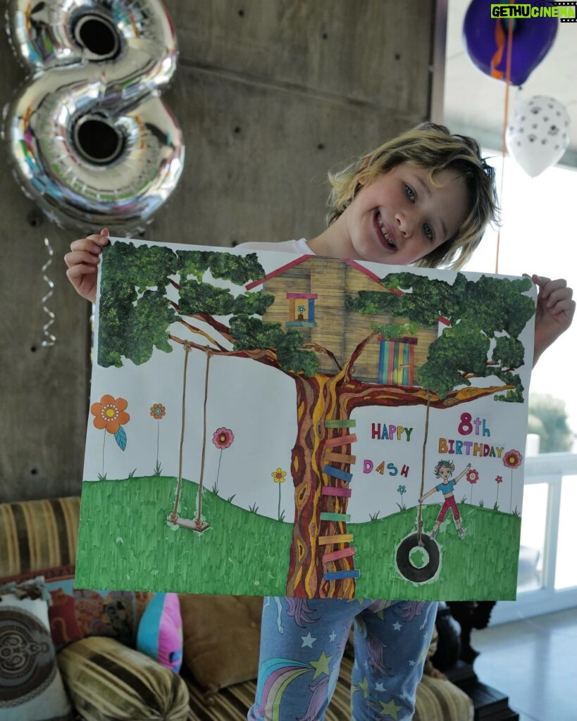 Milla Jovovich Instagram - Happy 8th birthday to my sweet, kind, thoughtful and most loving little girl Dash! She’s really the rock of our family. Such an amazing big sister to the baby, such a wonderful little sister as well. Here are some pics with the cards that we made for her! I collaged a “Magical Treehouse” card and her dad made a collage of the two of them over the years. Her older sister made the most beautiful and creative pop up card that’s so cool! Also thank you to @ballooncelebrations for the epic balloon fantasy land she woke up to this morning!