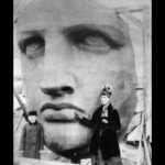 Lauren Cohan Instagram - New artwork for DEAD CITY, coming to a billboard near you…

When Lauren first told me about the new Walking Dead spinoff that takes place in NYC, I immediately had an image in my mind of Maggie and Negan facing off in the hollowed eye sockets of a decaying Statue of Liberty. We eventually realized that Lady Liberty was actually not big enough for 2 people to stand in the eyes, but after a few mockups and revisions we arrived at another composition with the characters in the foreground. This final version was made by the amazing artists at @the_la_agency (they do all your favorite movie posters) with art direction and supervision by the AMC team: Ed Benitez, Nancy Hennings, Michelle Ragone, Ahmed Fakhr and Mark Williams. Photography by James Dimmock.