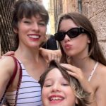 Milla Jovovich Instagram – I’m so excited to have been invited to attend the @amfar event and help raise money for this cherished cause in Venice, Italy! It’s been a healthy decade I haven’t been to Venice and it’s such a dream coming back here. Riding from the airport in a water taxi, watching the delicate, medieval city, opening up before me in such a calming and soothing way after a long and sleepless flight. The feel of the boat rocking underneath me is already getting me prepared for delights to come. We float on the water and get dropped at our hotel, which is a thousand year old monastery that was actually abandoned for over one hundred years before it got renovated into a hotel.  A bit on the spooky side, but I’m totally in to see some ghosts, hands down!  The light is so gorgeous everywhere that even with no sleep on the flight (I started playing Baldur’s Gate 3🤯 and I wasn’t about to have something as pesky as sleep stop me from jumping down that rabbit hole😂 ) I just put on minimal make up, tinted sunscreen, mascara, spf lipstick, I feel red carpet ready! This light ignores signs of jet lag and literally gives you a wink and secretly hands you 5 years back without even asking for a thank you. We’re only here for a few days, @everanderson is here working with the wonderful team @miumiu, doing her thing  and we brought our little Dash with us so we could make her feel grown up and special. It’s hard to give all three of my girls proper mama time when our 3 year old , Osian, is around. She’s just a mighty force of nature that demands absolute and undivided attention and the more you give, you know it’s only enough when your essence has completely disappeared into her own. She’s a smart kid😂. Goes without saying that we’re having a blast! I’ll go through more photos and do a nice dump when I get home! Thank you @amfar again for believing in me and having me here to support you for so many amazing years and thank you @miumiu for always taking care of my incredible young woman, my heart, Ever. ❤️🧨💥✨✨✨