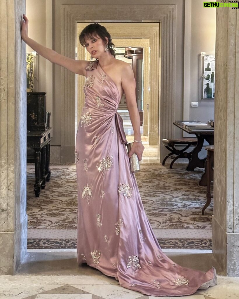 Milla Jovovich Instagram - What a beautiful trip to Venice I had! Thank you so much @amfar for all the amazing work you’ve done and congratulations on raising over $2 million for AIDS research! I’m so proud to have worked with your organization for over two decades and help raise awareness to such an important cause. Also, a big shout out to @chopard jewels for the gorgeous earrings I got a chance to wear for the evening and @prada for making me this glorious gown so many years ago for the red carpet in Cannes that I got the chance to wear again for this gala! My family and I had so much fun exploring the city and I have so many wonderful pictures to share, but I couldn’t fit them all in one post, so I’ll be posting more once I have the chance to go through them. These are some of my favorites from the night of the event and I’ll choose more from my personal family pics and put them up when I get a chance!💋❤️✨
Thank you to my amazing glam squad:
Make up: @nikipinna
Hair: @la_pellizzaro