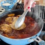 Ree Drummond Instagram - 🍑   🥃   BBQ   🍗 Love this winner of a chicken dinner! Simmers about an hour and the chicken is fall-apart tender. Chicken thighs, onion, whiskey, barbecue sauce, garlic, peach preserves, Worcestershire, peaches…serve over mashed potatoes or just eat it by itself! Sometimes I’ll remove the chicken and reduce the sauce to thicken…but I was too impatient for that this time. Peach whiskey bbq chicken FTW! (And I love my new denim blue PW cookware 🤓)