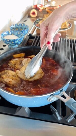 Ree Drummond Instagram - 🍑   🥃   BBQ   🍗 Love this winner of a chicken dinner! Simmers about an hour and the chicken is fall-apart tender. Chicken thighs, onion, whiskey, barbecue sauce, garlic, peach preserves, Worcestershire, peaches…serve over mashed potatoes or just eat it by itself! Sometimes I’ll remove the chicken and reduce the sauce to thicken…but I was too impatient for that this time. Peach whiskey bbq chicken FTW! (And I love my new denim blue PW cookware 🤓)