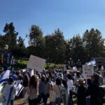 Mayim Bialik Instagram - It was a thrill and an honor to speak at my alma mater UCLA today to bring attention to the 240 hostages being held by Hamas since October 7. The event was co-sponsored by every Jewish organization on campus and featured 3 very moving displays featuring baby strollers with the names of every child being held hostage, as well as a shoes and balloons display and a table set for those being held in tunnels underneath Gaza city. Thank you Bruins for Israel for organizing such a moving event. #NoHostageLeftBehind 💙 🤍 💙 @ucla @bruinsforisrael