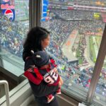 Chanel Iman Instagram - Our baby girl Capri’s first football game🏈 @chauxdown ❤️Team Godchaux @patriots 🙌🏾