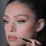 Nicola Peltz Beckham Instagram - glam by family @kateleemakeup and @hairbyadir for Lola premiere 🩷🪽🩷