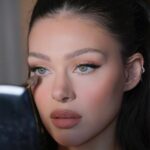 Nicola Peltz Beckham Instagram - glam by family @kateleemakeup and @hairbyadir for Lola premiere 🩷🪽🩷