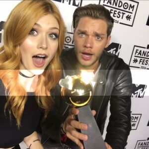 Katherine McNamara Instagram - Happy birthday to a man with an absolute heart of gold who’s had my back for nearly a decade, @domsherwood. 💛 Even if he’s taping me to a trailer or scaring the shit out of me, he always makes sure that my hair is out of my face and my heart is okay. :) 

Dom, thank you for being a caring, hysterical, supportive, trustworthy, loyal, mischievous, amazing friend, confidant, baseball team captain, and partner in crime. 🥎 Thank you for always being there with a hug or a shot of whiskey when I need it - sometimes both. 😜 I know I can always count on you. Here’s to many more adventures… and many more shots of whisky. Love ya, bud. 🥃 🧁