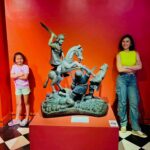 Beauty Gonzalez Instagram - The National Museum is always a good idea🤍
Swipe to the last photo to see our favorite Sculpture
By Our National Hero Jose Rizal. 
It is titled ‘ Mother’s Revenge’
It shows a Mama Dog viciously attacking a Crocodile who has just eaten its Puppy. 
I really wanted Olivia to see that. 
Fair Warning! He he