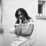 Vivienne Westwood Instagram - "We live in a world now, where we are allowed to have a slightly different outlook on life than in the past" –  Briana.⁠
⁠
Briana's reimagined look for 2024 is offered in a silk Moire fabric, with a shimmering finish. The voluminous asymmetric skirt features drape details, complete with a train at the back. The piece is offered alongside a matching fabric handmade bag, as originally crafted by Briana herself. ⁠
⁠
Photography by @kingsley_ifill⁠
Styling by @florahuddart⁠
Talent: @briannatoomer⁠
⁠
#VWBridal #WestwoodBridal