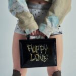 Vivienne Westwood Instagram - Our oversized Cropped Denim Boxer jacket features this season's floral jacquard, inspired by an archival corset from our Spring-Summer 1998 'Tied To The Mast' collection. ⁠
⁠
Style the piece with our Tyra Toy Box bag, featuring a bone motif that links together with rivets, forming the words 'Puppy Love'. The style is reminiscent of our Rock chicken bone T-shirt, from the archive 'Let It Rock' collection of 1971.⁠
⁠
Now available online and across our boutiques.⁠
⁠
#VWSS24