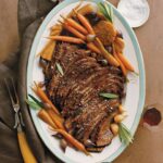 Martha Stewart Instagram - This braised brisket is meltingly tender and moist after being cooked low and slow in the oven with red wine and aromatics. Carrots, parsnips, and pearl onions are cooked in the same pan, so all you need to round out this entrée is rice or mashed potatoes, or maybe our crispy potato kugel gratin if you're serving this delicious main course for Passover dinner. Slice the meat thin against the grain for a brisket everyone will savor and ask you to make again and again. Get the recipe at the link in our bio.