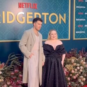 Nicola Coughlan Instagram - Surprise Oz! Lady Whistledownunder is in town 

So excited to kick off the Bridgerton World Tour in Australia! This moment has been literal years in the making I’m so excited we can finally start to share Season 3 with you all ❤️

A special thank you to THE Richard Quinn- I contacted him because I have been obsessed with this dress since I first saw it on the runway and dreamed of wearing it. I asked him if he and his brilliant team made it for me and they they did and it’s better than I ever could’ve imagined 🖤

Styled by @aimeecroysdill wearing custom @richardquinn & @malonesouliers 
Makeup @danielmartin 
Hair @gavinanesburybeauty 
@vrwpublicity 

#bridgerton #bridgertoninbowral