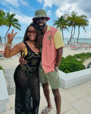 Tabitha Brown Instagram - Happy ❤️. Still celebrating 26 years together and 21 years of marriage ❤️ #tabandchance 
Bathing suit @versace 
Coverup @target