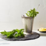 Martha Stewart Instagram - Refreshing and strong, a mint julep is a must on Derby Day, or any summer gathering. This classic southern cocktail starts with muddled mint leaves mixed with lemon juice and sugar, which is then mixed with bourbon and ice. A sprig of mint is the perfect garnish. Get the recipe at the link in our bio. 📷: @bryangardnerphotography