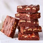 Martha Stewart Instagram - Earn plenty of brownie points by offering these chewy, gooey treats to your kids or to friends on any festive occasion. What makes them so extra? The fudgy base is covered with pecan halves, cream caramel, and melted chocolate—a combo borrowed from old-fashioned turtle candies. Get the recipe at the link in our bio. 📷: @ren_fuller