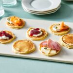 Martha Stewart Instagram - These bite-sized silver dollar pancakes can be served well beyond the breakfast table. Their mild, slightly sweet flavor and small size are perfect for topping with both sweet and savory ingredients. They can be passed around during cocktail hour as a simple hors d’oeuvre, or even served with a cup of coffee or tea at dessert. No matter when they’re served, you’ll flip for these fluffy bite-sized cakes. Get the recipe at the link in our bio. 📷: @kelseynhansen